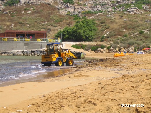 Ghajn Tuffieha Bay with a dredger - back to browser